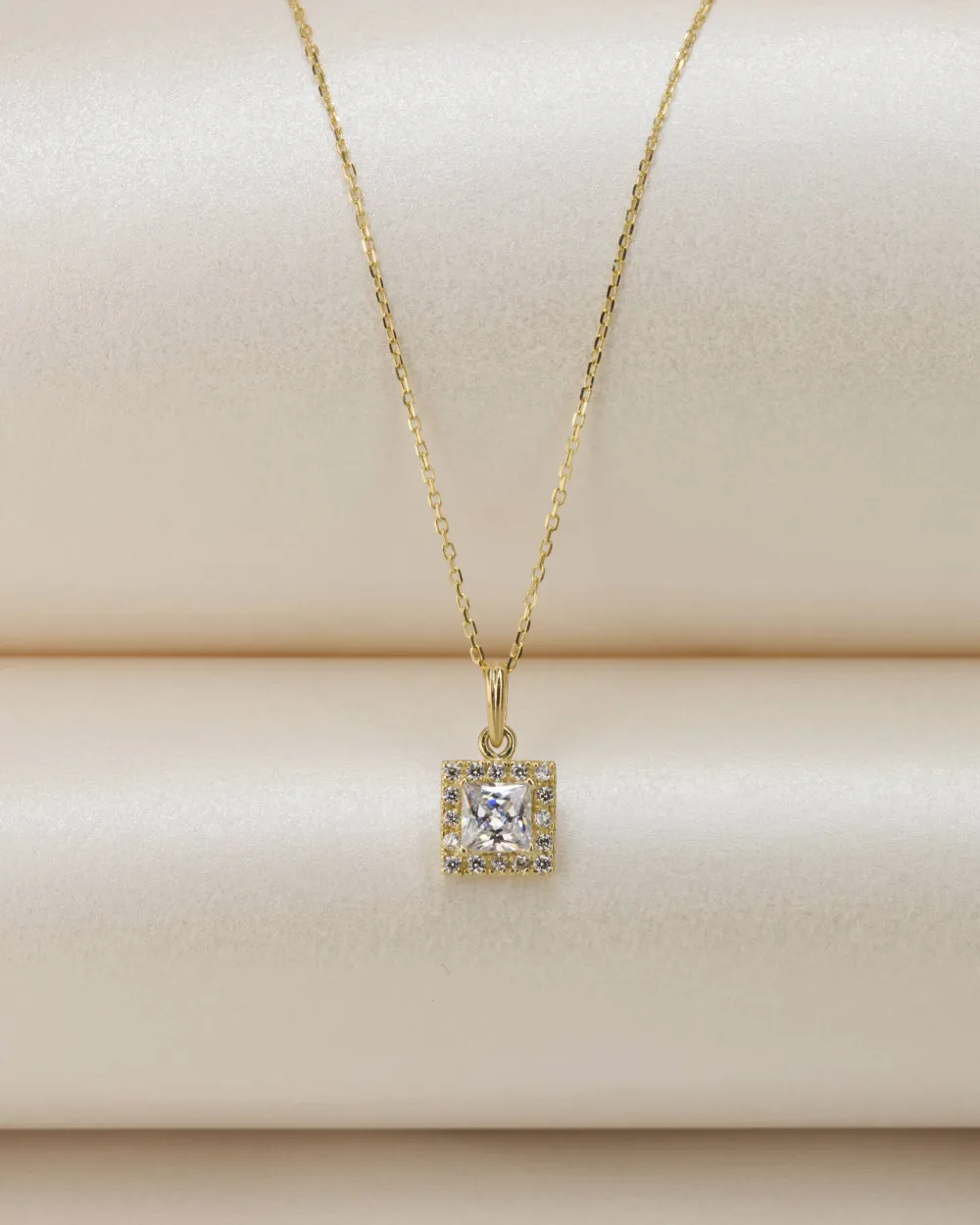 Square halo pendant on a gold chain